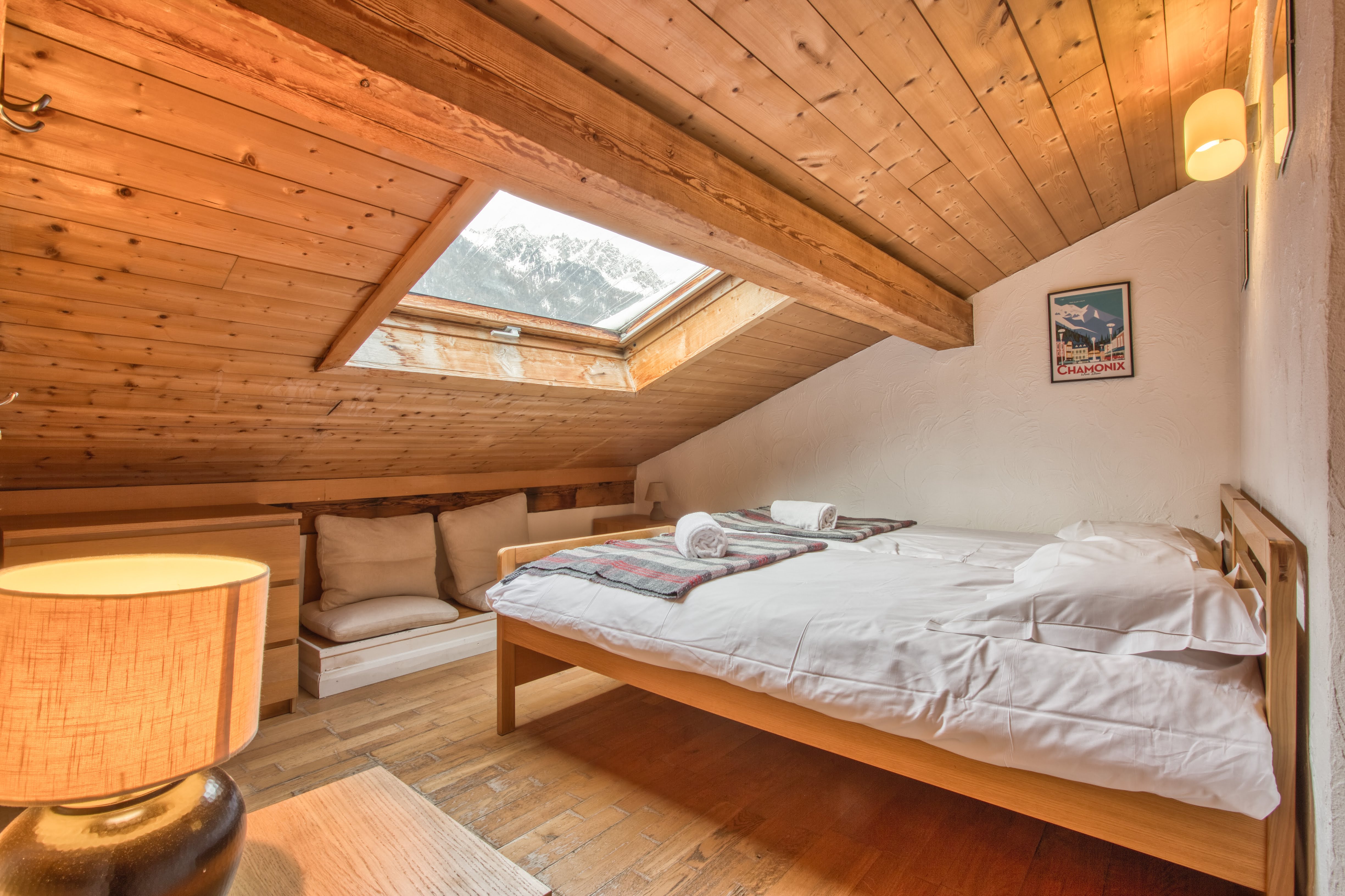 Upstairs twin bedroom with mountain-style timber interior