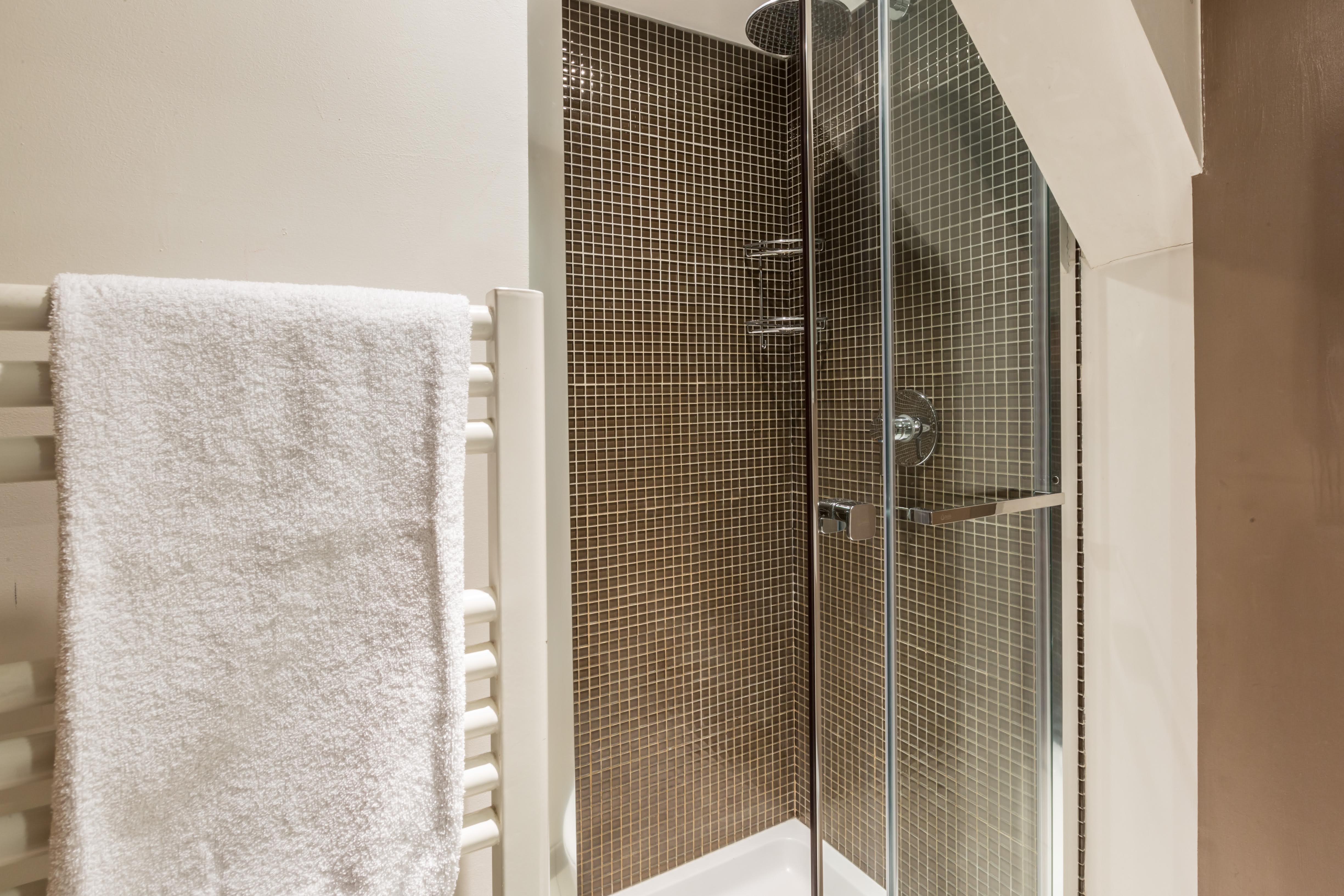 Shower room with toilet and hand basin